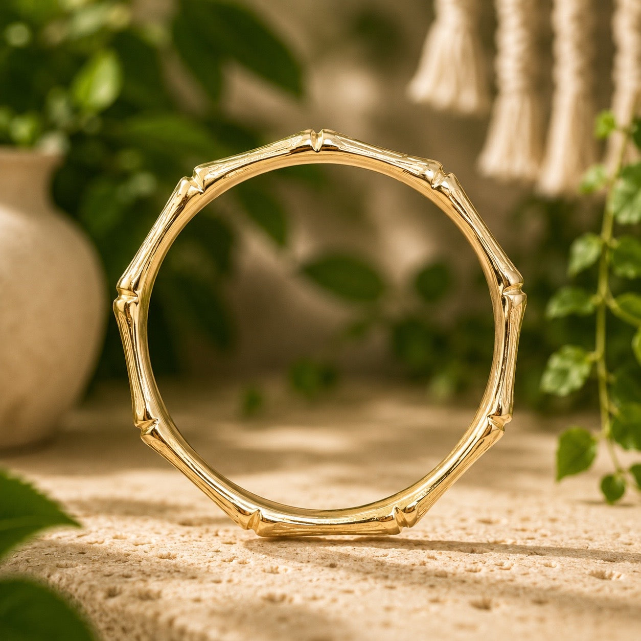 brass bamboo style  bracelet on a wooden surface with a natural background