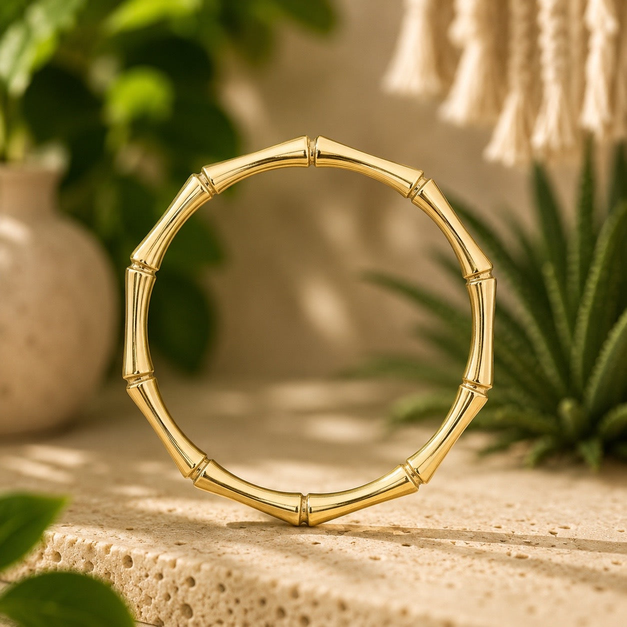 brass bamboo style  bracelet on a wooden surface with a natural background