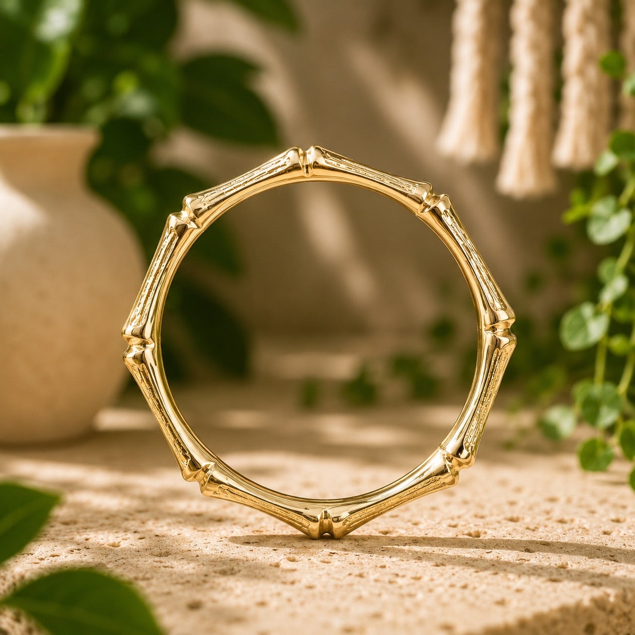 brass bamboo style  bracelet on a wooden surface with a natural background